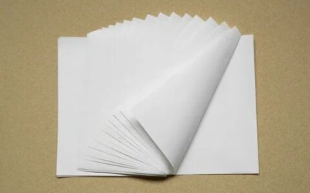 How Does Custom Greaseproof Paper Enhance Product Packaging?